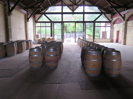 Empty oak barrels in the chai at Château Batailley. 
