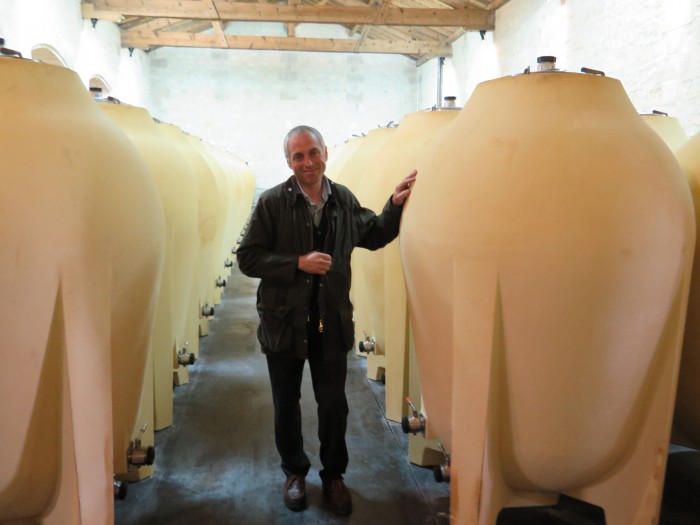 Jean-Michel Comme, winemaker at Château Pontet Canet, with the new amphorae. Some 35% of the 2013 wine is being matured in these vessels, which are made from the very terroir (clay, crushed rock, etc.) of the Pauillac estate. Photo : Courtesy Château Pontet Canet.
